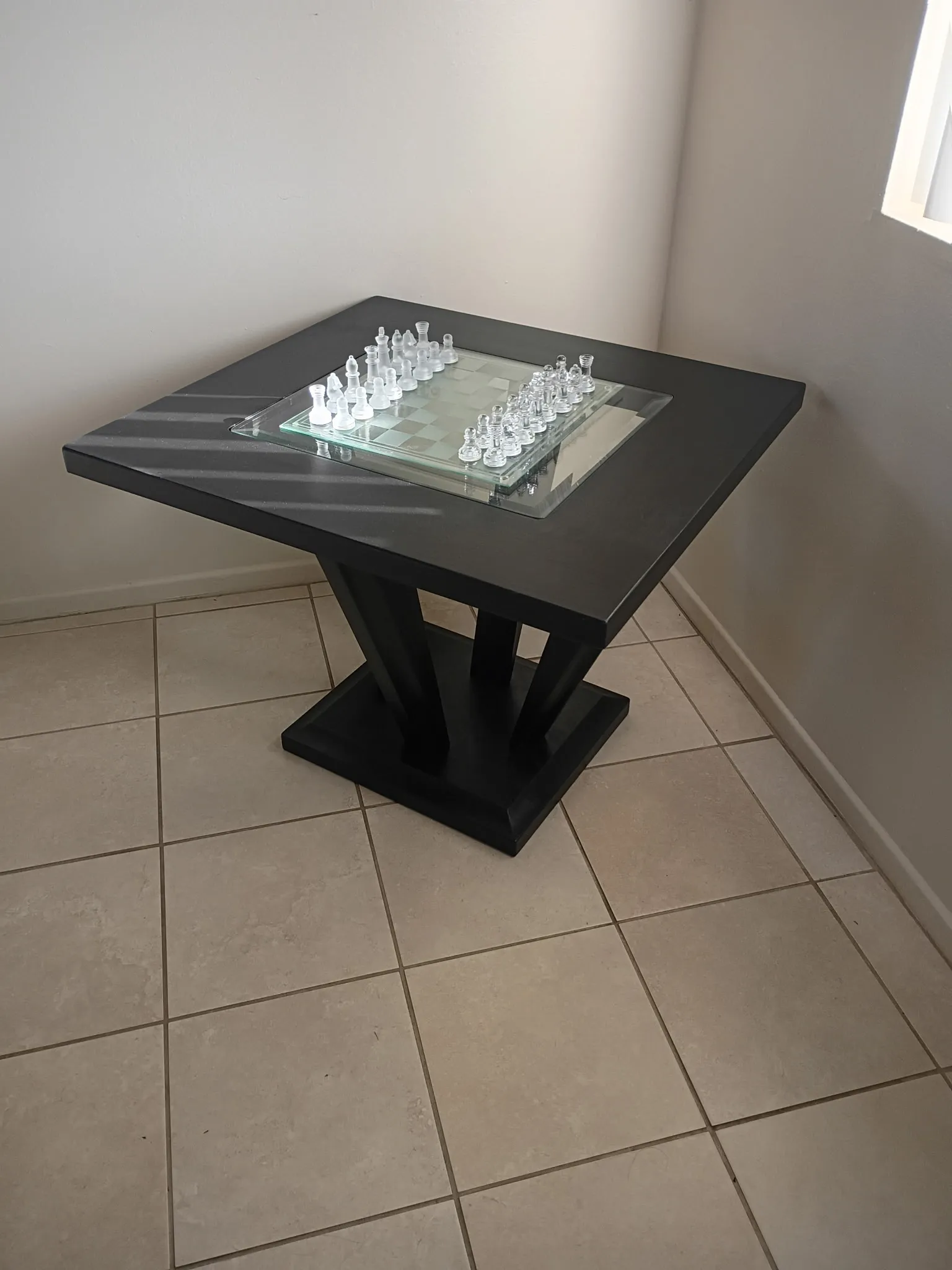 Chess table after refinishing: matte black finish with glass chessboard inset