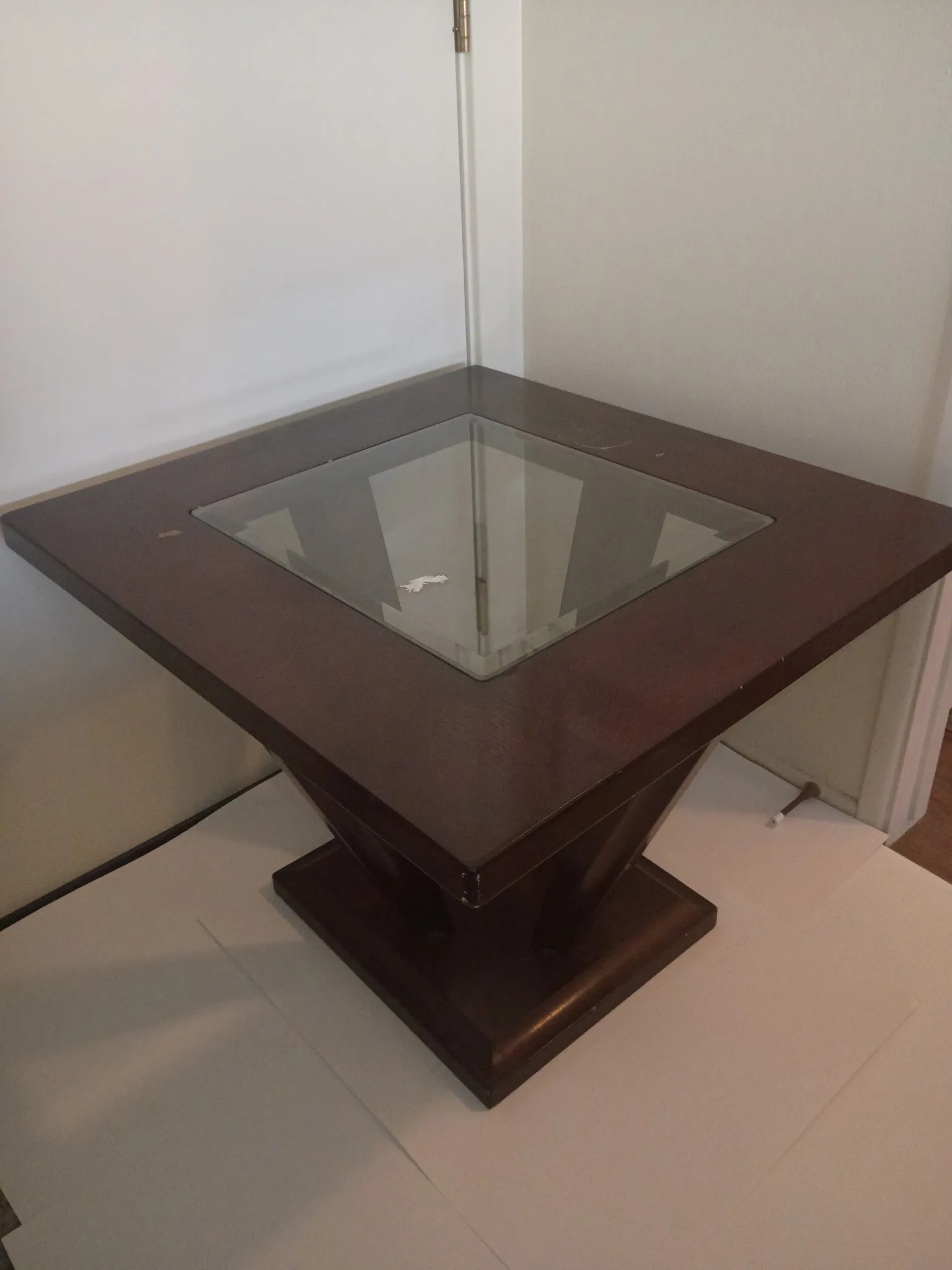 Chess table before refinishing: worn brown wood with plain glass inset