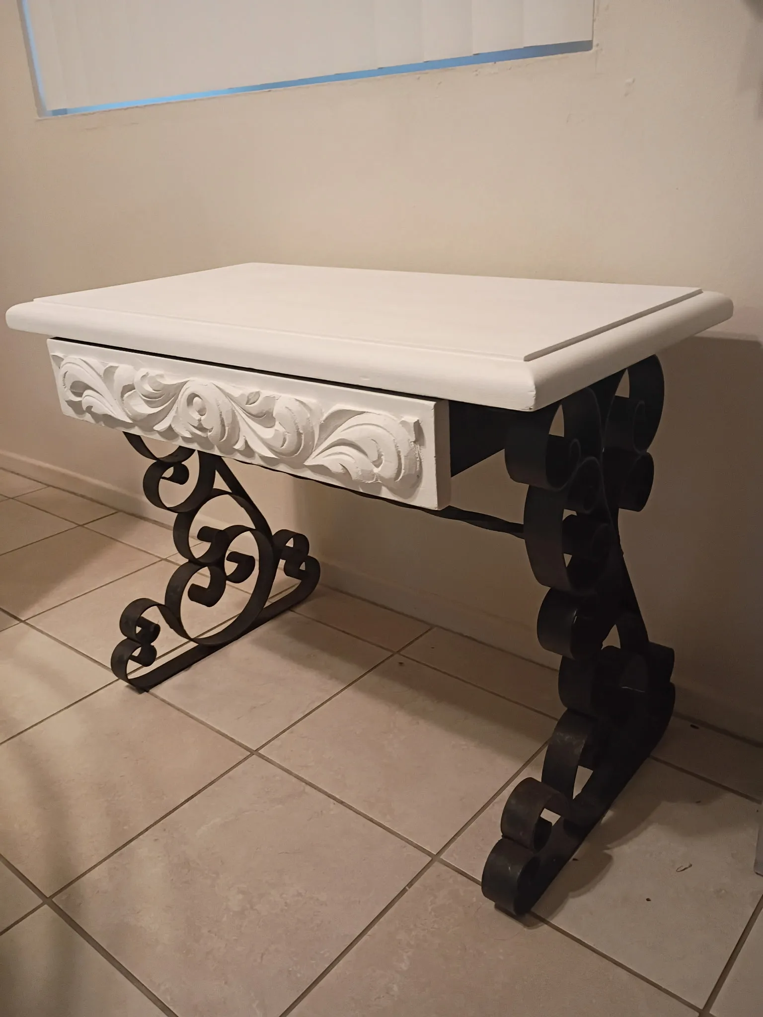 Console table after refinishing: white top and drawer with black iron scroll legs